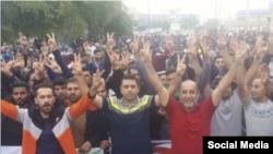 In this photo of sugar plantation workers who began a protest in Shush, Iran, Nov. 5, 2018, two protest leaders detained for alleged security offenses can be seen: Moslem Armand (left) and Ismail Bakhshi (second from left).