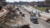 FILE - Work proceeds on an Interstate Highway 75 project in Hazel Park, Mich., April 20, 2020, President Joe Biden’s administration will soon begin touting the benefits of a proposed package of infrastructure investments.