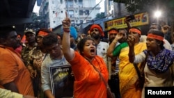 FILE - Hindu activists chant slogans demanding the release of the Bangladeshi jailed Hindu monk leader Chinmoy Krishna Das Brahmachari, during a protest to condemn his arrest, in Kolkata, India, Nov. 28, 2024. 
