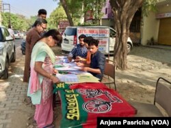 Some voters arrived early Thursday to search for their names on the electoral rolls and beat long lines.