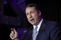 FILE - Democratic U.S. Senate candidate Cal Cunningham speaks to supporters during a primary election night party in Raleigh, N.C., March 3, 2020.
