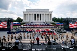 FILE - Two Bradley Fighting Vehicles flank the stage being prepared in front of the Lincoln Memorial in Washington, ahead of planned Fourth of July festivities with President Donald Trump, July 3, 2019.