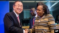 United Nations Secretary General Ban Ki-moon, left, greets Central African Republic President Catherine Samba-Panza as he arrives for a meeting on Central African Republic prior to the EU Africa summit at the EU Council building in Brussels, April 2, 2014