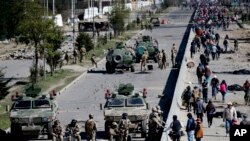 FILE - Soldiers guard the Senkata fuel plant in El Alto, on the outskirts of La Paz, Bolivia, Nov. 20, 2019.