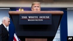 President Donald Trump speaks about the coronavirus, with Vice President Mike Pence nearby, in the James Brady Press Briefing Room of the White House, April 24, 2020, in Washington, D.C.