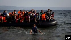 Syrian migrants crossing from Turkey arrive at Lesbos, Greece, Sept. 7, 2015. The island of some 100,000 residents has been transformed by the sudden arrival of some 20,000 refugees and migrants.