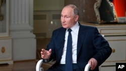 Russian President Vladimir Putin speaks to NBC News journalist Keir Simmons in an interview that aired June 14, 2021, two days before the Russian leader is to meet U.S. President Joe Biden in Geneva. (Maxim Blinov, Sputnik, Kremlin Pool Photo via AP)