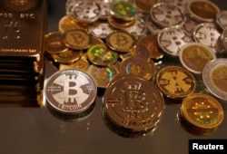 Bitcoins created by enthusiast Mike Caldwell are seen in a photo illustration at his office in Sandy, Utah, Sep. 17, 2013.