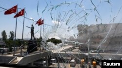 A damaged window is pictured at the police headquarters in Ankara, Turkey, July 18, 2016.