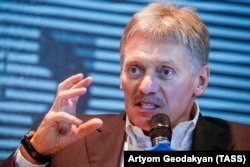 RUSSIA -- Kremlin spokesman Dmitry Peskov gestures as he speaks during an interview at the MediaDen Forum marking 5 years of Kommersant Journalism Academy, in Moscow, February 6, 2019