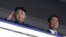 FILE - North Korean leader Kim Jong-un (L) salutes next to China's Vice President Li Yuanchao during a parade in Pyongyang July 27, 2013.