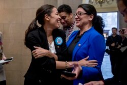 FILE - Rep. Alexandria Ocasio-Cortez, left, and Rep. Rashida Tlaib, Jan. 16, 2019.