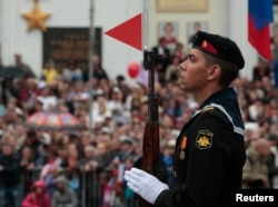 A sailor stands during a Victory Day military parade in Sevastopol, Crimea on May 9, 2014.