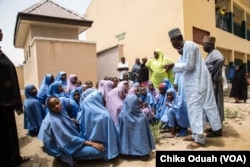 Students at Gamboru Primary School wait for more instructions from their teacher during a safety drill, May 2018.