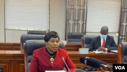 FILE - Monica Mutsvangwa, Zimbabwe’s information minister, talks to reporters in Harare, July 06, 2021. Mutsvangwa says a recent spike in COVID-19 cases has forced authorities to ask all government workers to be vaccinated. (Columbus Mavhunga/VOA)