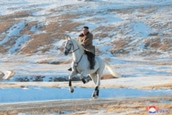 North Korean leader Kim Jong Un rides a horse during snowfall in Mount Paektu in this image released by North Korea's Korean Central News Agency.