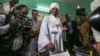 President Omar al-Bashir casts his ballot as he runs for another term, on the first day of the presidential and legislative elections, in Khartoum, Sudan, April 13, 2015. 