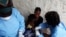FILE - A South Sudanese girl suffering from cholera is being treated by medics in Juba Teaching Hospital in Juba, May 27, 2014. More than 1.1 million doses of oral cholera vaccine arrived in Juba, and will be dispatched next week to hot spots areas like the town of Bentiu.