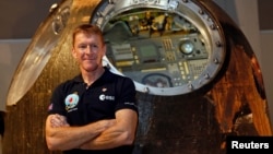 British astronaut Tim Peake poses before a news conference at the Science Museum in London, Nov. 6, 2015.