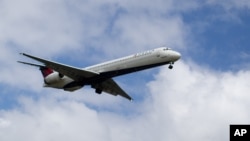 FILE - A Delta Air Lines plane arrives at Hartsfield–Jackson Atlanta International Airport, Aug. 8, 2016. Delta on Feb. 24, 2018, joined the list of U.S. companies indicating they were ending discount programs with the National Rifle Association.