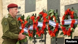 FILE - Israel's Chief of the General Staff Lieutenant-General Herzi Halevi places a wreath during a memorial ceremony of the Hamas attack on October 7 last year, at the Mount Herzl military cemetery in Jerusalem, Oct. 27, 2024. 