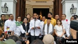 Incumbent Indonesian president Joko Widodo talks to media about the result of a presidential election, during a press briefing in Jakarta, Indonesia, April 18, 2019.
