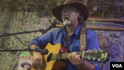 Michael Fox singing at the Oatman Hotel