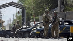 NATO-led Resolute Support forces inspect the site of a car bomb explosion in Kabul, Afghanistan, Sept. 5, 2019.