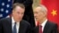 FILE - Chinese Vice Premier Liu He, right, talks with U.S. Trade Representative Robert Lighthizer, while they line up for a group photo in Beijing, Feb. 15, 2019.. 