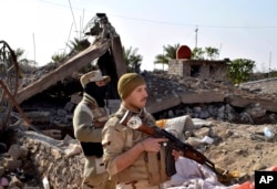 FILE - Iraqi soldiers retook Ramadi, but rebuilding is crucial. "Without a political strategy, there is only a military victory which can and will only be transient," a former Iraqi official said.