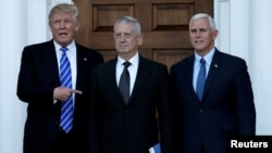 U.S. President-elect Donald Trump (L) and Vice President-elect Mike Pence (R) greet retired Marine General James Mattis in Bedminster, New Jersey, Nov. 19, 2016. Trump has tapped Mattis to lead the Defense Department.