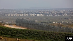 A picture taken from the Israeli-annexed Golan Heights Feb. 4, 2021, shows the border fence with the Syrian governorate of Quneitra.