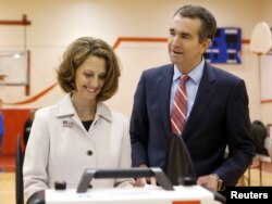 Virginia Lieutenant Governor Ralph Northam, the Democratic candidate for governor, and his wife, Pam, cast their ballots at the East Ocean View Community Center in Norfolk, Va., Nov. 7, 2017.