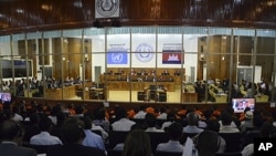 People attend a hearing for former Khmer Rouge leaders at the Extraordinary Chambers in the Courts of Cambodia (ECCC) on the outskirts of Phnom Penh, November 21, 2011.