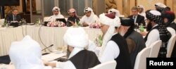 FILE - This undated handout picture shows U.S., Taliban and Qatari officials during a meeting for peace talks in Doha, Qatar. (Qatari Foreign Ministry)