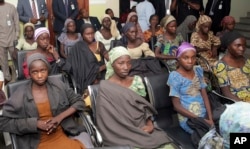 FILE - Chibok school girls, recently freed from Boko Haram captivity, are seen during a meeting with a government official in Abuja, Nigeria, Oct. 13, 2016.