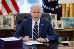 FILE - U.S. President Joe Biden speaks in the Oval Office at the White House in Washington, March 11, 2021.
