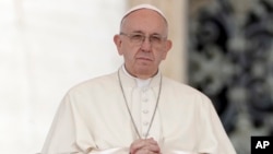 Pope Francis prays during his weekly general audience, in St. Peter's Square at the Vatican, April 11, 2018.