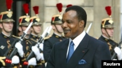FILE - President of the Republic of Congo Denis Sassou N'Guesso arrives at the Elysee Palace in Paris, Sept. 20, 2002. N'guesso seeks to extend his already three decades in power in elections Sunday.