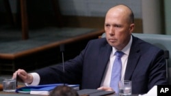 Australian former Home Affairs Minister Peter Dutton in Parliament in Canberra, Australia, Aug. 22, 2018. Dutton moved from the front row where Cabinet ministers sit to the back row after his bid to become prime minister failed Tuesday.