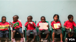 Student participating in Justice Rising's education programs sit in chairs.