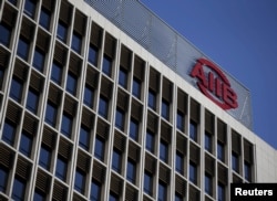 FILE - The logo of Asian Infrastructure Investment Bank (AIIB) is seen at its headquarters building in Beijing, Jan. 17, 2016.
