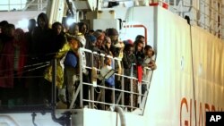 People gather at Bhumibol Bridge over Chao Phraya river in Bangkok, Thailand, to mark late King Bhumibol Adulyadej's birthday.