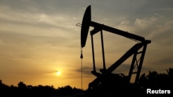 FILE - An oil pump is seen in Lagunillas, Ciudad Ojeda, in the state of Zulia, Venezuela, March 18, 2015.