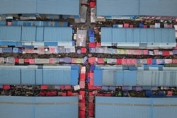 This aerial view shows people shopping for groceries at a farmers' market in Jishou, in central China's Hunan province.