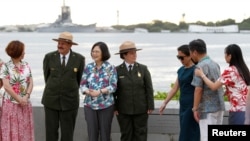 Taiwan's President Tsai Ing-wen, third from left, while en route to Pacific island allies, stands with delegates and National Park Service members at the USS Arizona Memorial at Pearl Harbor near Honolulu, Hawaii, Oct. 28, 2017.