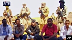 Image taken from video and provided by U.S.-based SITE Intelligence Group shows the first images of a group of foreign hostages working for a French energy company who were seized in Niger two weeks ago by an al-Qaida offshoot, according to the group that