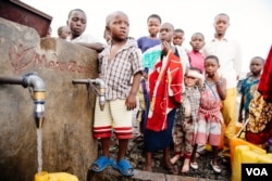 FILE - Children prepare to wash their hands, in Goma, Democratic Republic of Congo. (Courtesy of Mercy Corps.)
