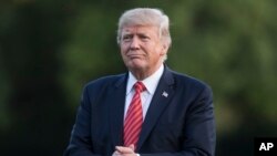 U.S. President Donald Trump, seen in this Aug. 23 photo, on Friday directed the Pentagon to declare an indefinite ban on transgender individuals joining the military, but he appeared to leave open the possibility of allowing some already in uniform to remain in the military.