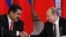 Russian President Vladimir Putin (R) shakes hands with his Venezuelan counterpart Nicolas Maduro during a signing ceremony at the Kremlin in Moscow, July 2, 2013.